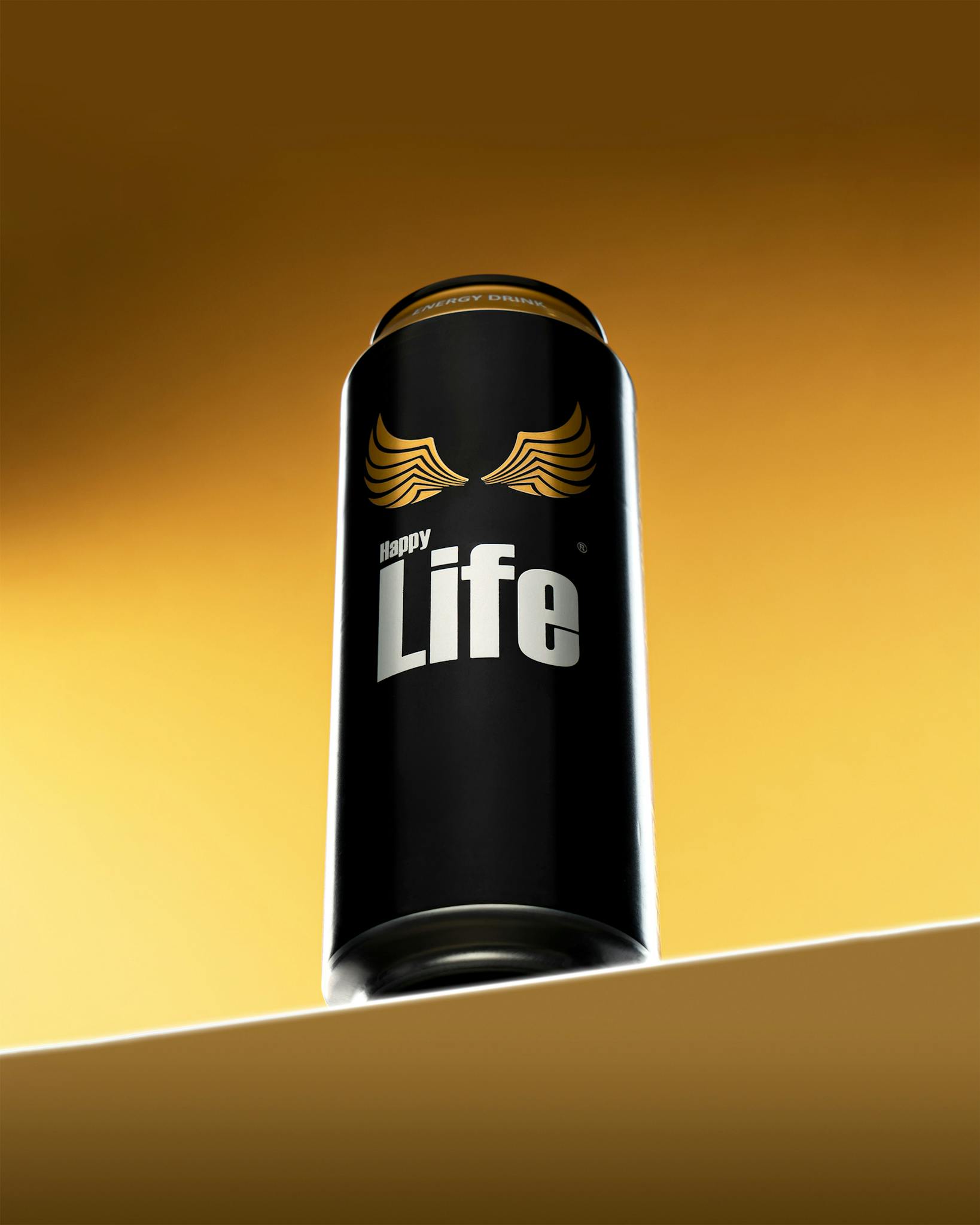Energy drink can with 'Happy Life' branding on a gold background.