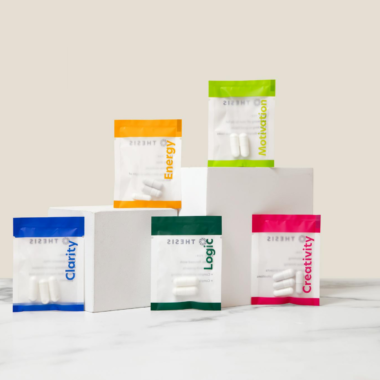 Vibrant display of nootropic supplements showcasing energy, motivation, creativity, and clarity on white blocks.